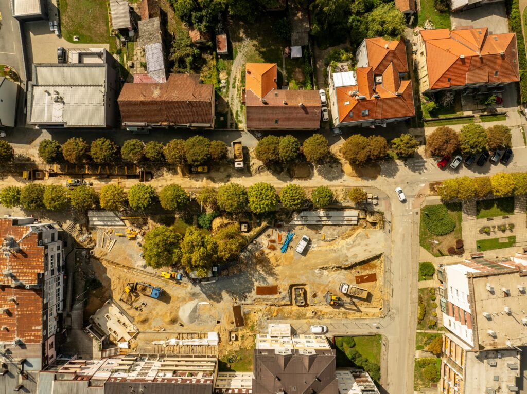 Aerial shot of a construction site amidst residential buildings in Garešnica, Croatia.